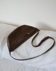 This full-grain leather Sling bag is designed for comfort and convenience, making it a great travel accessory or festival bag. With a durable metal zipper closure, cotton lining, and an adjustable strap, this versatile leather belt bag can be worn comfortably as a crossbody bag or hip bag. The back features an exterior zippered pocket for added security.