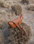 This full-grain leather Sling bag is designed for comfort and convenience, making it a great travel accessory or festival bag. With a durable metal zipper closure, cotton lining, and an adjustable strap, this versatile leather belt bag can be worn comfortably as a crossbody bag or hip bag. The back features an exterior zippered pocket for added security.