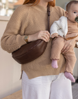 This full-grain leather Sling bag is designed for comfort and convenience, making it a great travel accessory or festival bag. With a durable metal zipper closure, cotton lining, and an adjustable strap, this versatile leather belt bag can be worn comfortably as a crossbody bag or hip bag. The back features an exterior zippered pocket for added security.