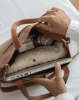 Leather Tote Bag
Full grain leather, unlined hand bag. It It comes with fixed leather handles. It’s held shut by a sturdy snap closure.