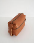 Full grain leather necessaire. Essential travel accessory. Small makeup bag
It is lined with cotton fabric. Wide-open interior for easy access to toiletries and other daily essentials. Featuring two zippered exterior pockets.
