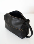 Full grain leather necessaire. Essential travel accessory. Small makeup bag
It is lined with cotton fabric. Wide-open interior for easy access to toiletries and other daily essentials. Featuring two zippered exterior pockets.