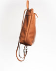 CASIA Andes L leather backpack in caramel full-grain vegetable-tanned leather, side view