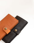 Natural-grained unlined wallet. It features a front snap closure, 8 card slots, 2 bill compartments plus a zippered interior pocket.