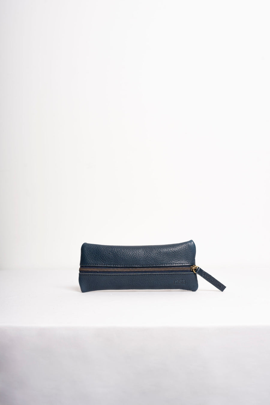 Full grain leather zippered pencil case.