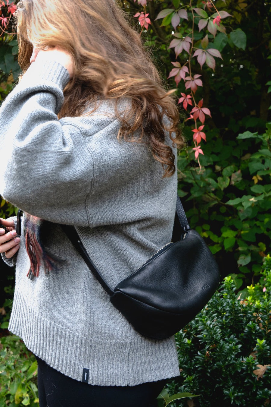 This full-grain leather Sling bag is designed for comfort and convenience, making it a great travel accessory or festival bag. With a durable metal zipper closure, cotton lining, and an adjustable strap, this versatile leather belt bag can be worn comfortably as a crossbody bag or hip bag. The back features an exterior zippered pocket for added security.