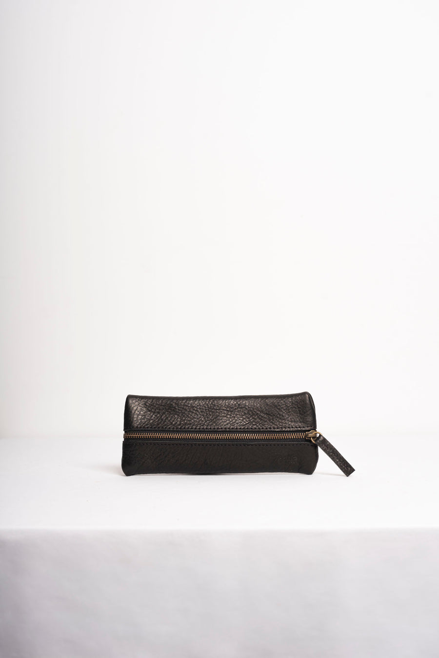 Full grain leather zippered pencil case.