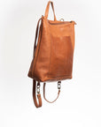 CASIA Andes L leather backpack in caramel full-grain vegetable-tanned leather, side 
view