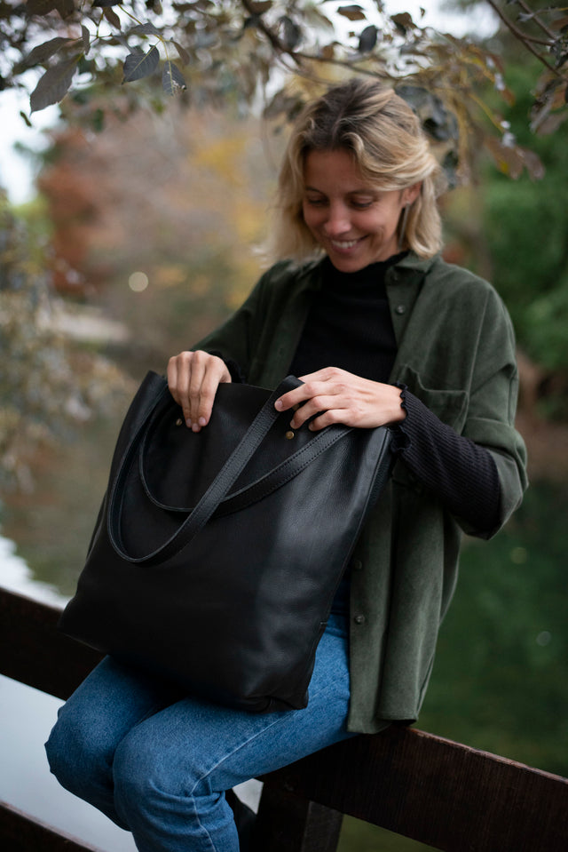 Full grain leather unlined tote bag. It features two interior pockets